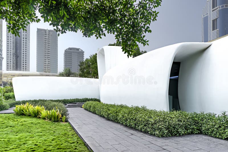 Dubai, United Arab Emirates - Jun.15, 2018: The worldâ€™s first fully functional 3D printed building in green lawns. Dubai, United Arab Emirates - Jun.15, 2018: The worldâ€™s first fully functional 3D printed building in green lawns