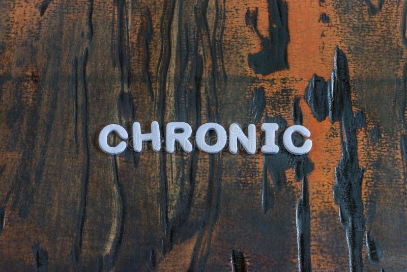 Das Wortchronische geschrieben in weiße Blockschrift stockfoto Das Wortchronische geschrieben in weiße Blockschrift stockfoto