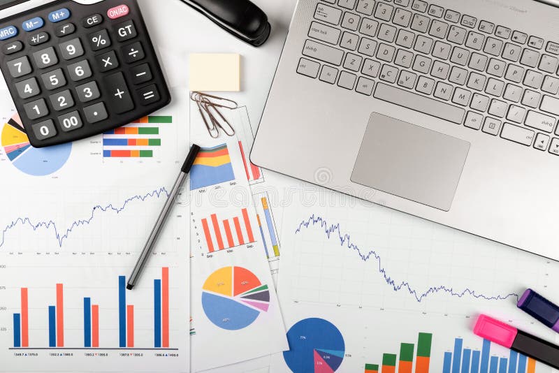 Data analysis - workplace with business graphs and charts stock images