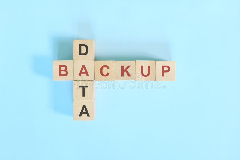 Data Backup Concept in Computer and Information Technology. Wooden Blocks Crossword Puzzle Flat