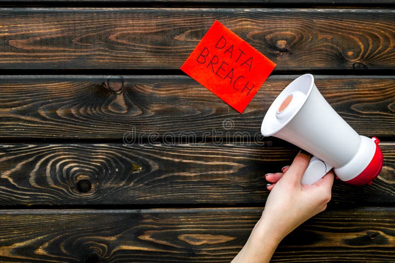 Download Data Breach Concept With Megaphone On Wooden Background ...