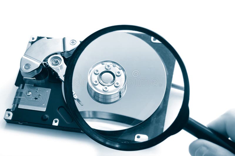 Hard disk-drive and hand holding a magnifying glass. Could represent a data search or computer security. Spy image stock images, royalty-free photos and pictures