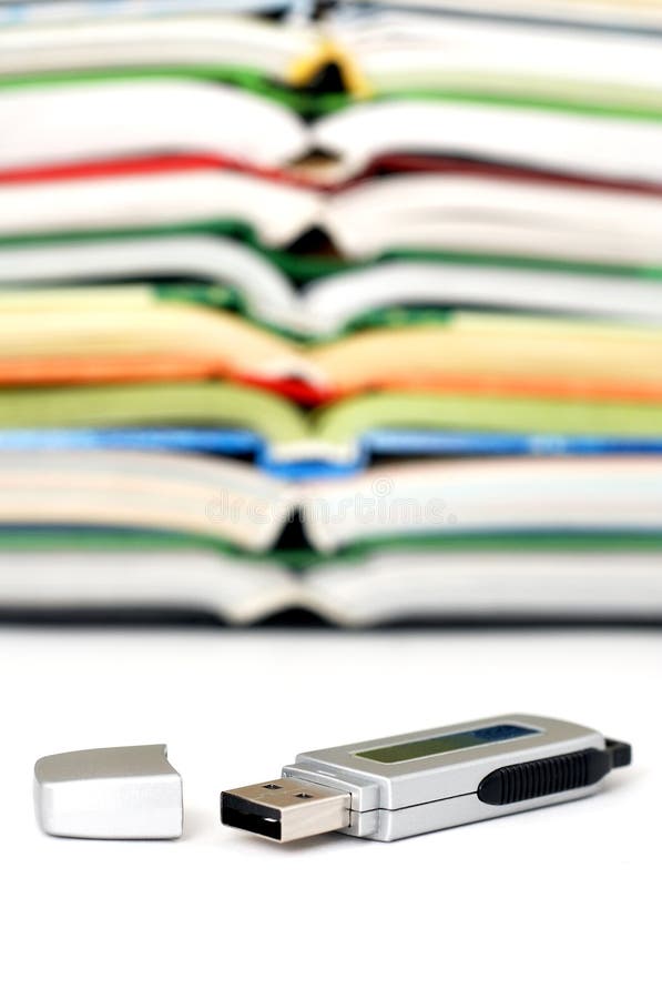 Electronic data storage with books. Usb data transfer stock images, royalty-free photos and pictures