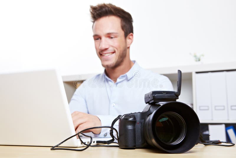 Data transfer with USB cable from digital camera to laptop computer. Data transfer with USB cable from digital camera to laptop computer