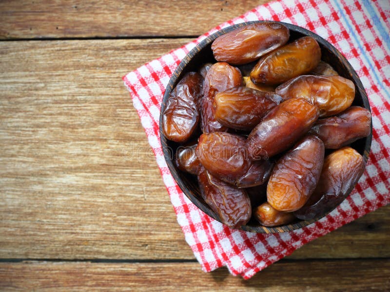 Datepalm in Wood Bowl with Cup of Tea on Wood Stock Image Image of