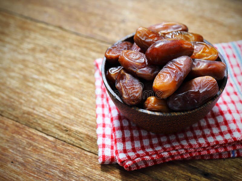 Datepalm in Wood Bowl with Cup of Tea on Wood Stock Image Image of