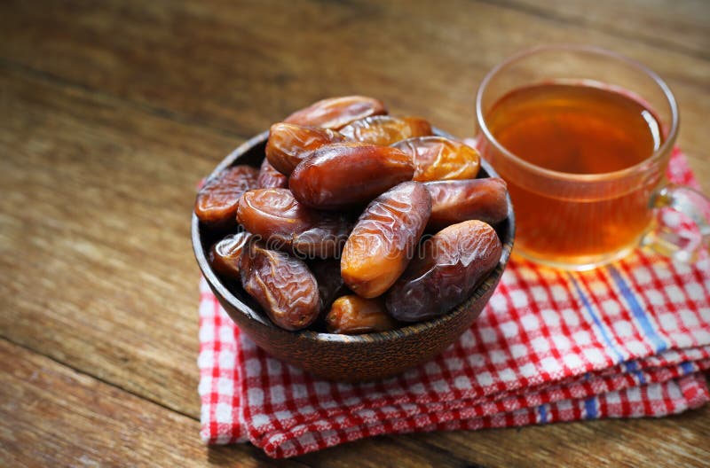 Datepalm in Wood Bowl with Cup of Tea on Wood Stock Image Image of