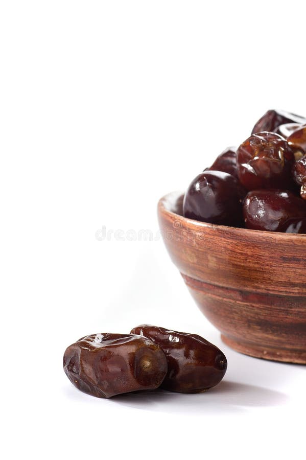 Dates in Bowl on a White Background. Dried Dates Fruit Stock Image