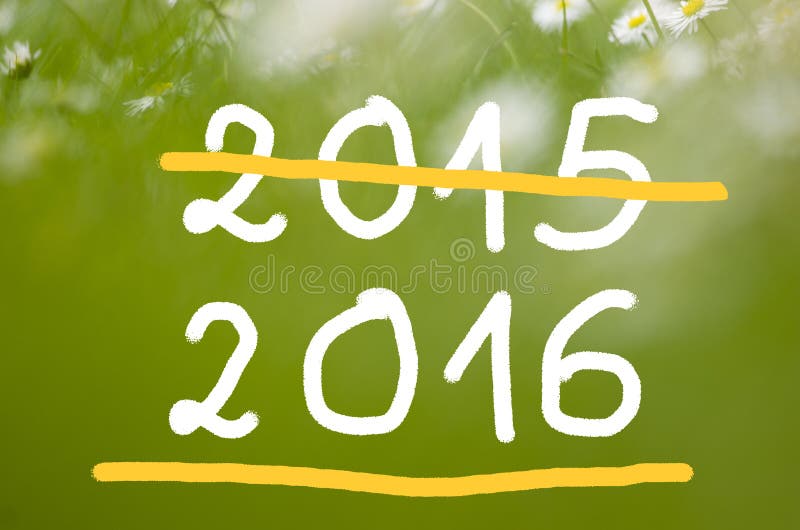 Date 2015 going to 2016 handwritten on real natural green background. Date 2015 going to 2016 handwritten on real natural green background.