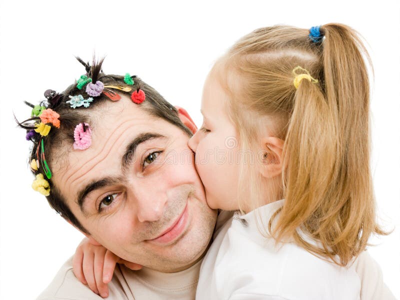 Daughter kissing her father