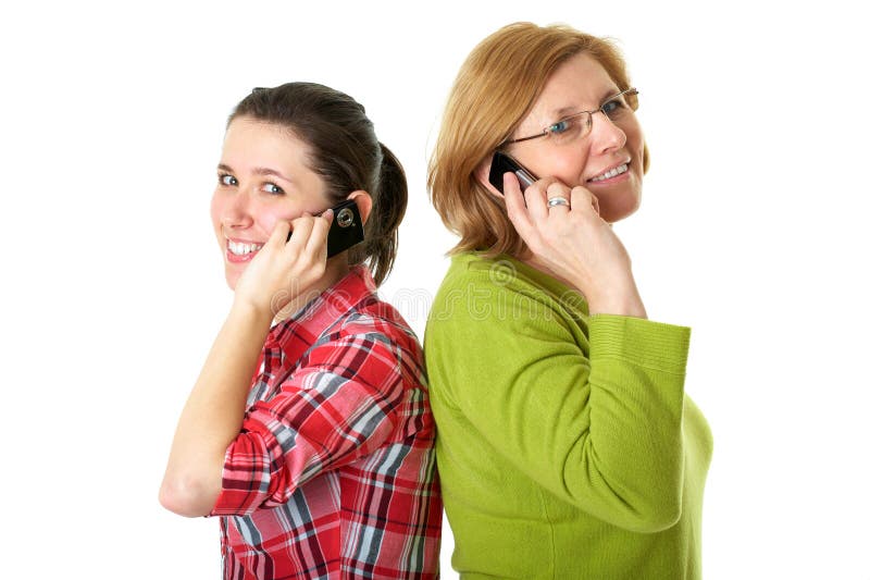 Daughter and mother talks over mobile phones royalty free stock image