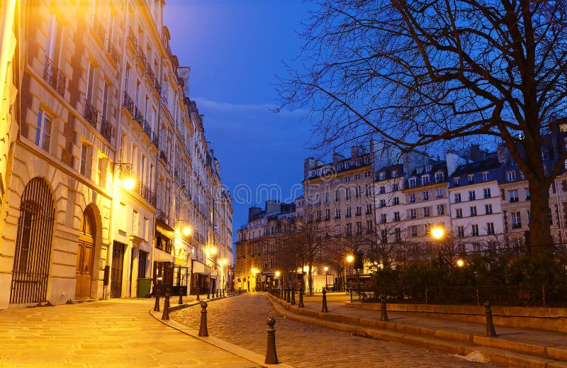 Dauphine square lined with quintessentially Parisian buildings, art galleries and cafes and lovely little cobblestone streets, Paris, France. Dauphine square lined with quintessentially Parisian buildings, art galleries and cafes and lovely little cobblestone streets, Paris, France.