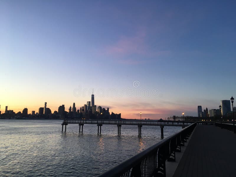 Dawn above Manhattan, New York, NY - View across Hudson River from Hoboken, New Jersey.