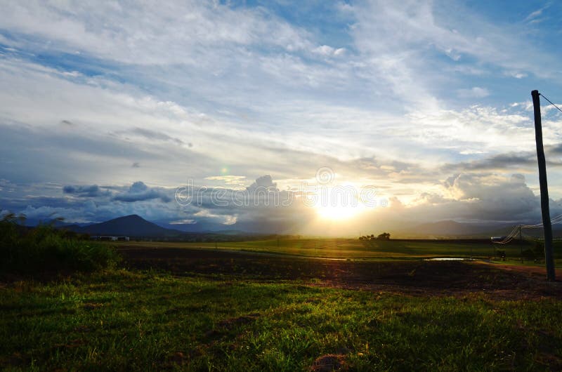 Dawn breaking over farming land countryside