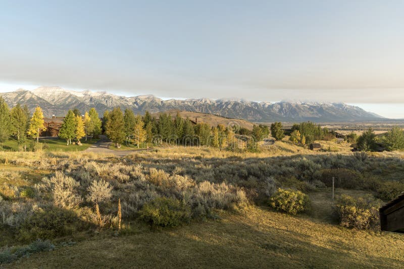 Dawn and a weather front over the Grand Tetons from Spring Creek Ranch Jackson