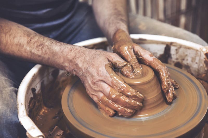 A Day in the Life of a Pottery Artist at the Pottery Wheel. Stock
