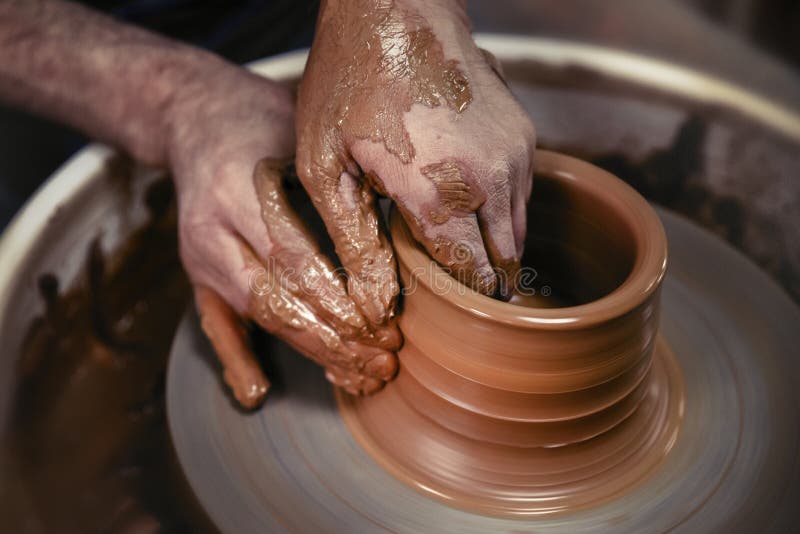 A Day in the Life of a Pottery Artist at the Pottery Wheel. Stock