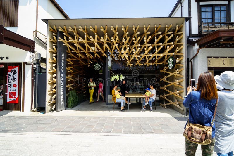 Dazaifu, Japan - May 14, 2017 :Tourists taking photo of iconic Starbucks coffee store