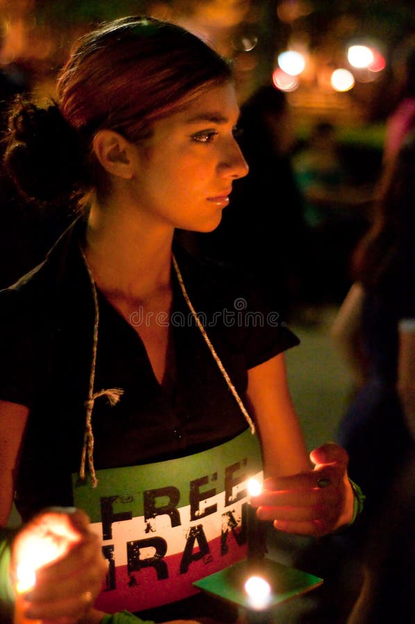 WASHINGTON, DC - JULY 2, 2009: Activists participate in a candle light vigil at Washington, DC's Dupont Circle park to protest the outcome of Iranian elections in which Mahmoud Ahmadinejad claimed victory, and after which scores of Iranians have been killed in protests. WASHINGTON, DC - JULY 2, 2009: Activists participate in a candle light vigil at Washington, DC's Dupont Circle park to protest the outcome of Iranian elections in which Mahmoud Ahmadinejad claimed victory, and after which scores of Iranians have been killed in protests.