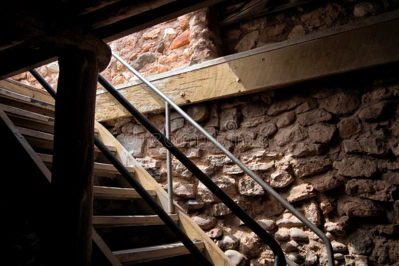 Stairs and rock walls of an old west home farm cellar said to be haunted by ghosts. Stairs and rock walls of an old west home farm cellar said to be haunted by ghosts.