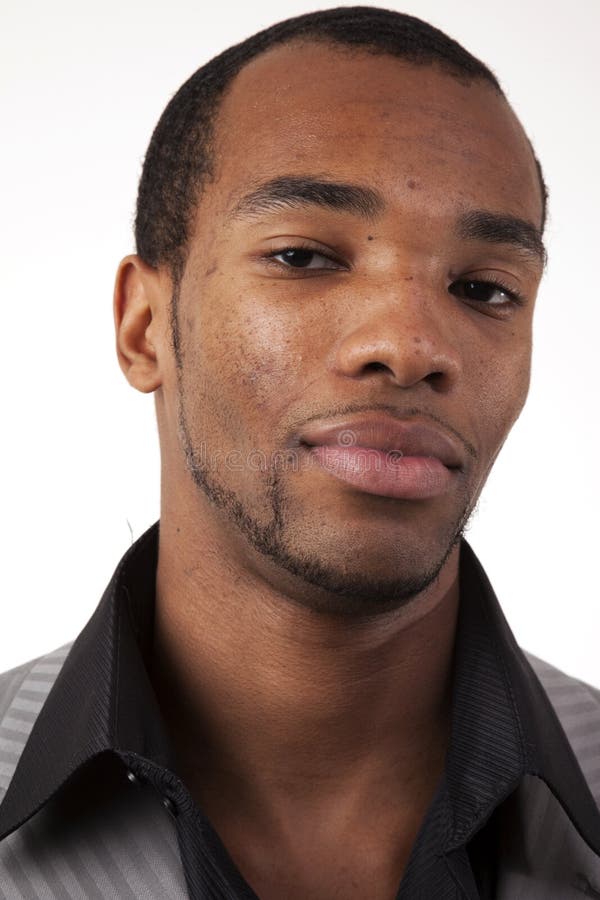 Headshot of african american man, emphasizing right side of face. Headshot of african american man, emphasizing right side of face.