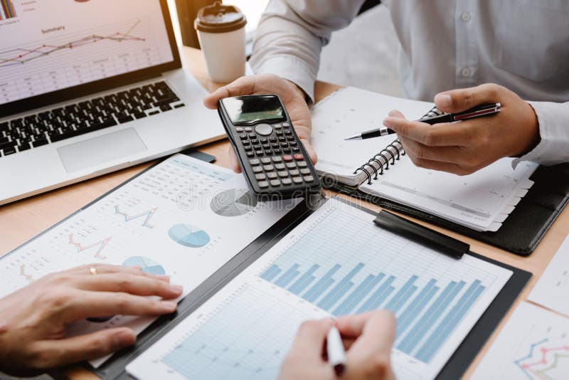 Two businessmen discussion analysis sharing calculations about the company budget and financial planning together on desk at the office room. Two businessmen discussion analysis sharing calculations about the company budget and financial planning together on desk at the office room.