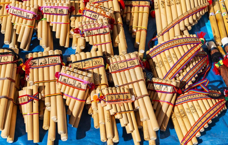 Traditional Andes pan flutes or panpipes on a market stall in Cusco, Peru. It is a traditional music instrument that can be found in Peru, Ecuador and Bolivia. Traditional Andes pan flutes or panpipes on a market stall in Cusco, Peru. It is a traditional music instrument that can be found in Peru, Ecuador and Bolivia.