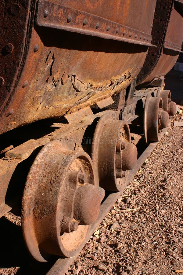 Rusting wheels on an antique mining cars on rails in Tombstone Arizona. Rusting wheels on an antique mining cars on rails in Tombstone Arizona