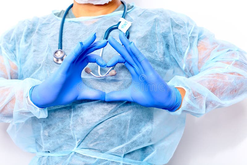 De arts dient handschoenen in de vorm tegen de achtergrond van zijn lichaam in close-up royalty-vrije stock afbeelding De arts dient handschoenen in de vorm tegen de achtergrond van zijn lichaam in close-up royalty-vrije stock afbeelding