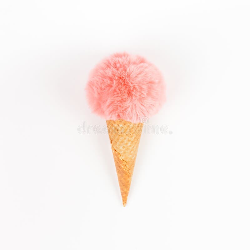Creative top view flat lay of coral color fluffy fur ball in ice cream waffle cone with copy space on white background in minimal style. Concept feminine blog social media. Natural light with shadows. Creative top view flat lay of coral color fluffy fur ball in ice cream waffle cone with copy space on white background in minimal style. Concept feminine blog social media. Natural light with shadows