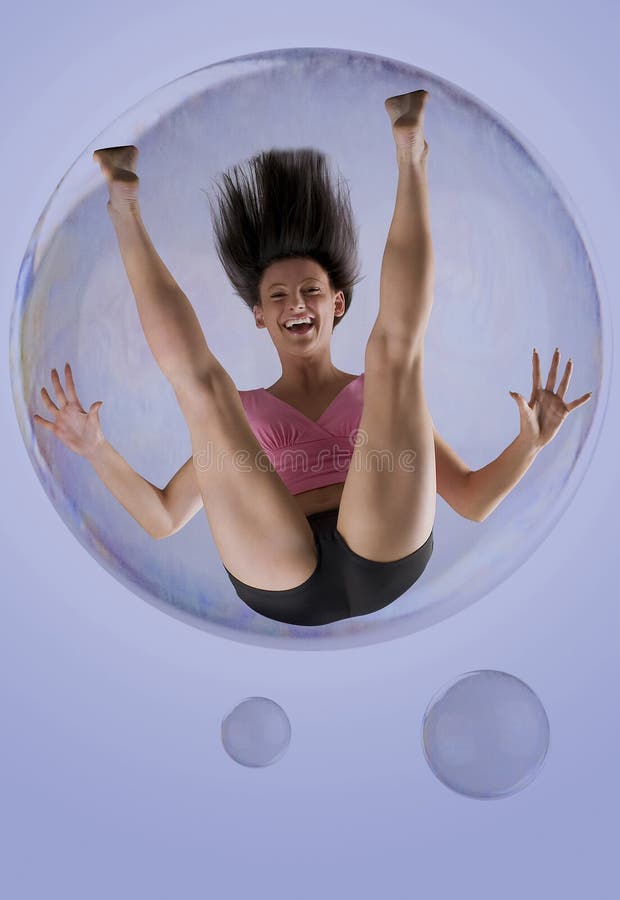 Nice brunette flying away inside a soap bubble. Nice brunette flying away inside a soap bubble