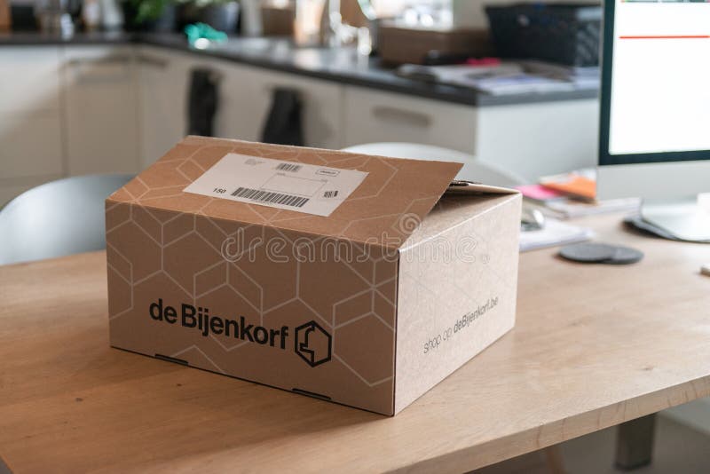 De Bijenkorf Online Package Delivery, Unboxing Package, Online Shopping, Fashion Shoes, White Sneakers, Box on the Table Editorial Stock Image - of netherlands, delivery: 162214864