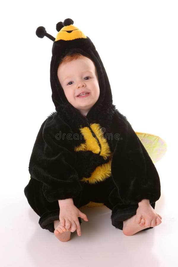 De bijenzitting van de peuter stock fotografie De bijenzitting van de peuter stock fotografie