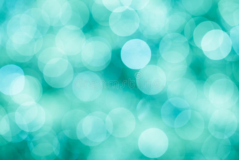 De blauwe, groene en turkooise achtergrond met bokeh defocused lichten stock fotografie De blauwe, groene en turkooise achtergrond met bokeh defocused lichten stock fotografie