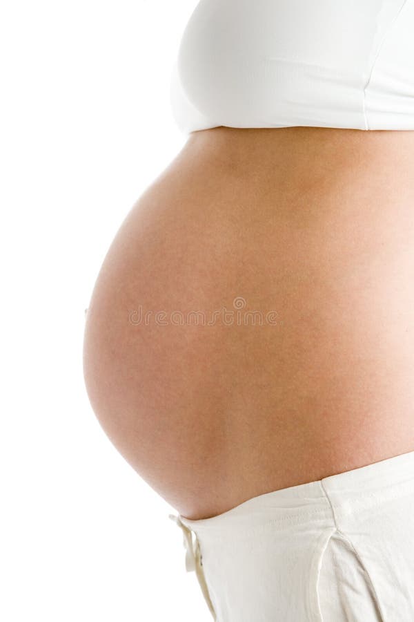 De blootgestelde buik van de zwangere vrouw royalty-vrije stock afbeelding De blootgestelde buik van de zwangere vrouw royalty-vrije stock afbeelding