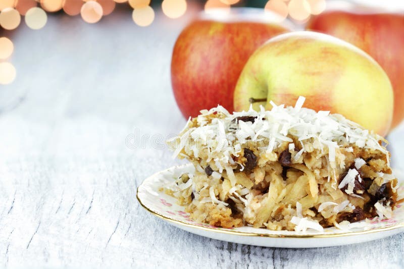 Apple casserole made of shredded apples, oats, coconut and raisins. Shallow depth of field with room for copy space. Apple casserole made of shredded apples, oats, coconut and raisins. Shallow depth of field with room for copy space.