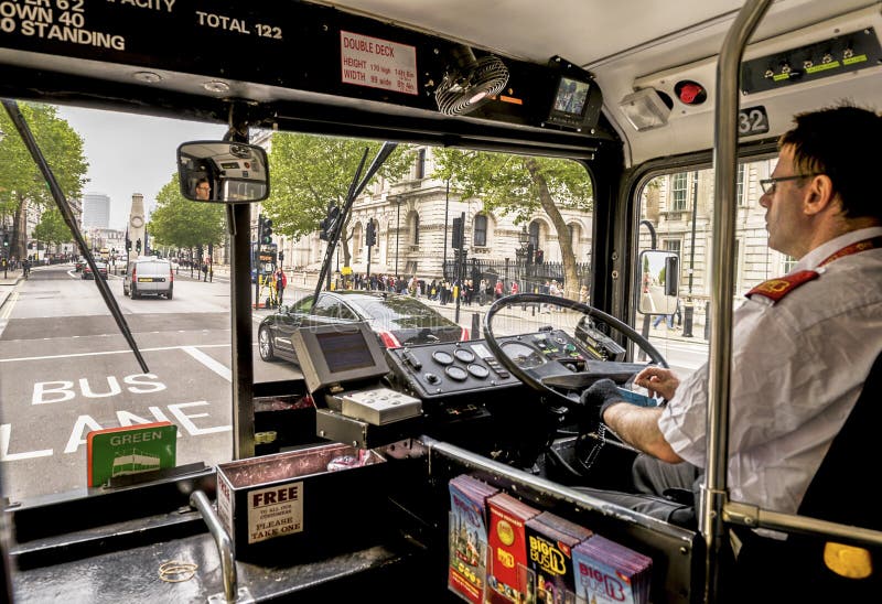 De buschauffeur van Londen stock afbeeldingen De buschauffeur van Londen stock afbeeldingen