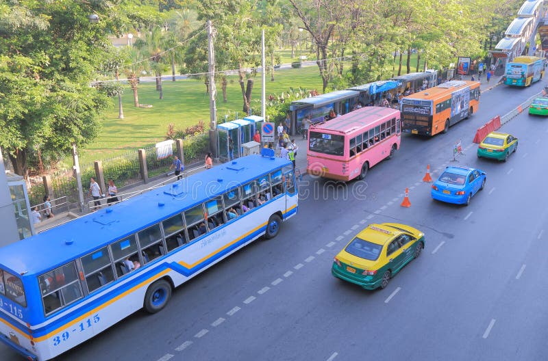 Local people catch buses at bus stop in Bangkok. Local people catch buses at bus stop in Bangkok.