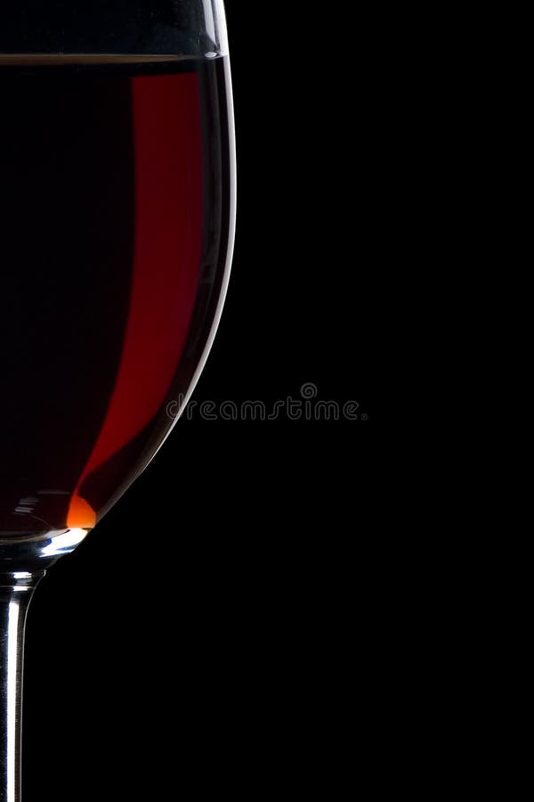 Red wine glass closeup with black background. Red wine glass closeup with black background