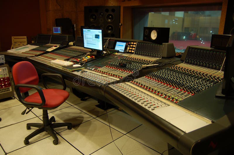 A recording studio is a facility for sound recording and mixing. Ideally both the recording and monitoring spaces are specially designed by an acoustician to achieve optimum acoustic properties (acoustic isolation or diffusion or absorption of reflected sound that could otherwise interfere with the sound heard by the listener). Recording studios may be used by record musicians, voice over artists for advertisements or dialogue replacement in film, television or animation, foley, or to record their accompanying musical soundtracks. The typical recording studio consists of a room called the studio or live room, where instrumentalists and vocalists perform; and the control room, where sound engineers operate professional audio for analogue or digital recording to route and manipulate the sound. Often, there will be smaller rooms called isolation booths present to accommodate loud instruments such as drums or electric guitar, to keep these sounds from being audible to the microphones that are capturing the sounds from other instruments, or to provide drier rooms for recording vocals or quieter acoustic instruments. A recording studio is a facility for sound recording and mixing. Ideally both the recording and monitoring spaces are specially designed by an acoustician to achieve optimum acoustic properties (acoustic isolation or diffusion or absorption of reflected sound that could otherwise interfere with the sound heard by the listener). Recording studios may be used by record musicians, voice over artists for advertisements or dialogue replacement in film, television or animation, foley, or to record their accompanying musical soundtracks. The typical recording studio consists of a room called the studio or live room, where instrumentalists and vocalists perform; and the control room, where sound engineers operate professional audio for analogue or digital recording to route and manipulate the sound. Often, there will be smaller rooms called isolation booths present to accommodate loud instruments such as drums or electric guitar, to keep these sounds from being audible to the microphones that are capturing the sounds from other instruments, or to provide drier rooms for recording vocals or quieter acoustic instruments.