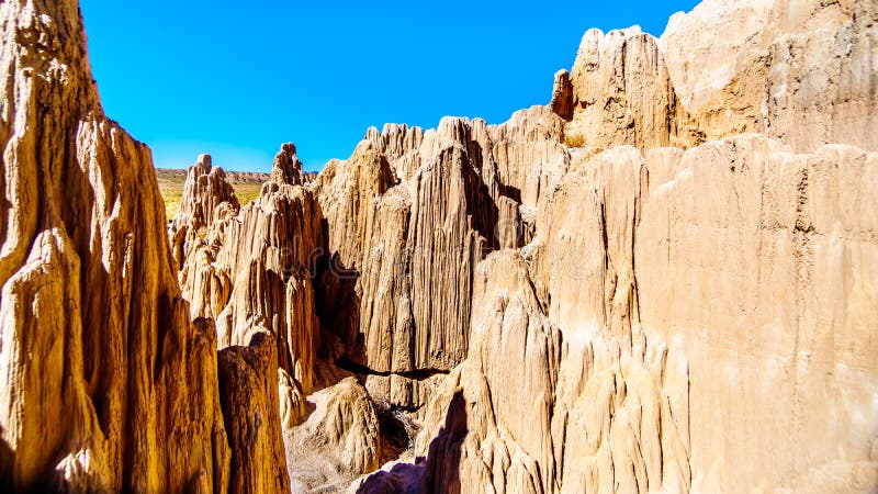 The dramatic and unique patterns of Slot Canyons and Hoodoos caused by erosion of the soft volcanic Bentonite Clay in Cathedral Gorge State Park in the Nevada Desert, United Sates. The dramatic and unique patterns of Slot Canyons and Hoodoos caused by erosion of the soft volcanic Bentonite Clay in Cathedral Gorge State Park in the Nevada Desert, United Sates