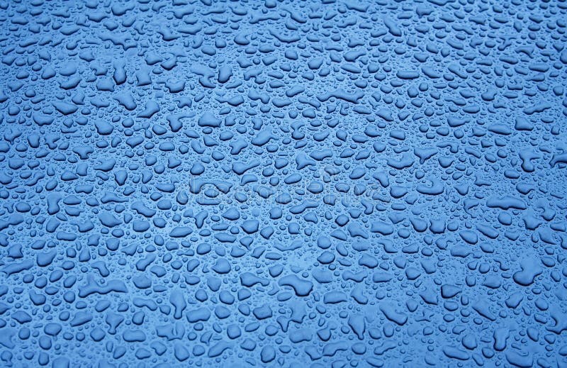 Water Droplets on a Blue Steel Surface. Close-up. Water Droplets on a Blue Steel Surface. Close-up