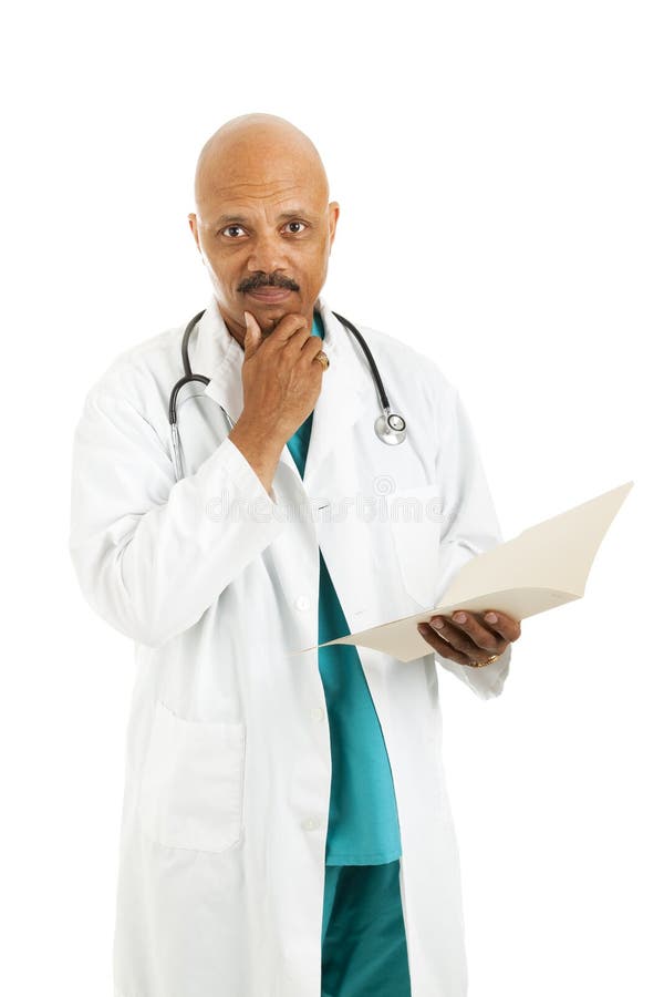 Serious african-american doctor considers treatment options while reviewing a patient's medical chart. Isolated on white. Serious african-american doctor considers treatment options while reviewing a patient's medical chart. Isolated on white.