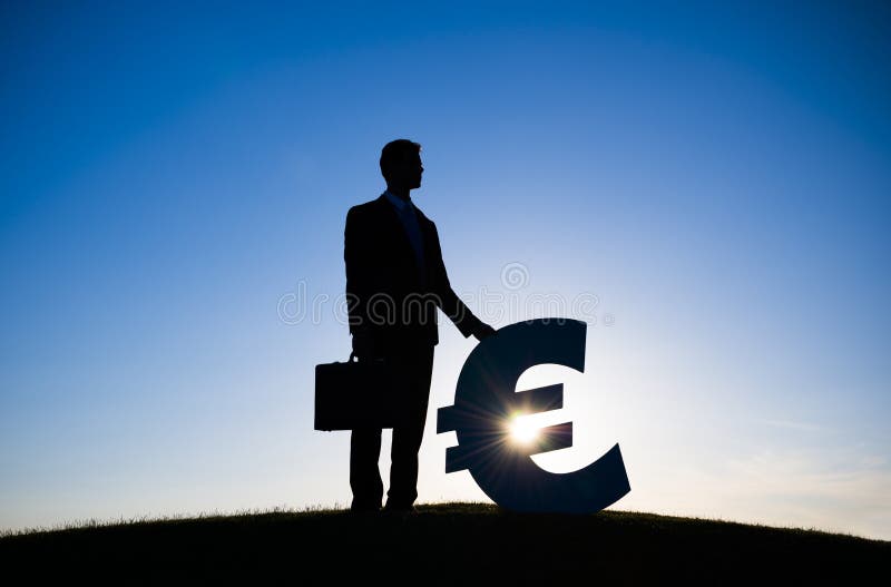 De EURO Munt van zakenmanHolding stock fotografie De EURO Munt van zakenmanHolding stock fotografie