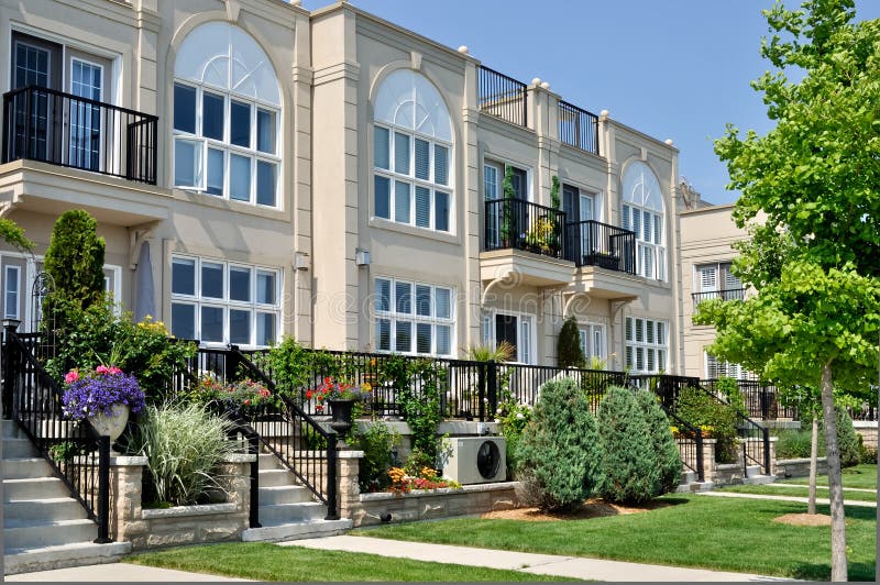 Modern Condominiums in urban setting under blue sky. Modern Condominiums in urban setting under blue sky