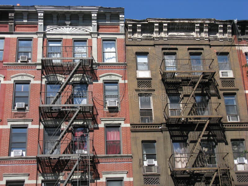 A row of tenement style apartment buildings on the Upper East Side of Manhattan, New York City. This neighborhood, known as Yorkville was predominantly made up of German immigrants who settled here in the late 19th and early 20th centuries. A row of tenement style apartment buildings on the Upper East Side of Manhattan, New York City. This neighborhood, known as Yorkville was predominantly made up of German immigrants who settled here in the late 19th and early 20th centuries.