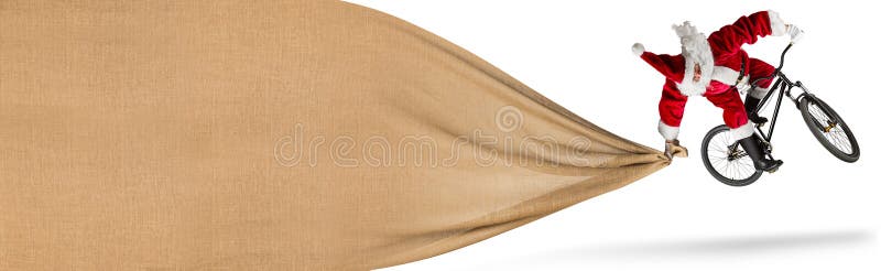 De gekke sprong van de Kerstman op de fiets van de vuilberg met grote reusachtige jute stock afbeelding De gekke sprong van de Kerstman op de fiets van de vuilberg met grote reusachtige jute stock afbeelding