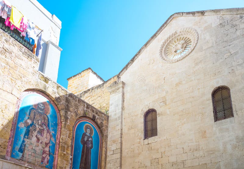 Bari, Italy, old town, upward view of the facade of the medieval church of San Marco Dei Veneziani. Bari, Italy, old town, upward view of the facade of the medieval church of San Marco Dei Veneziani