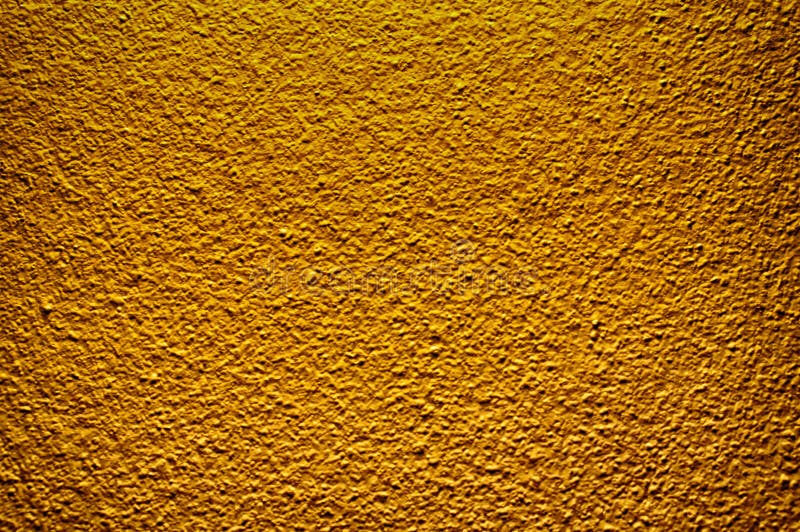De gouden achtergrond van de de verf abstracte textuur van de kleuren concrete muur stock afbeelding De gouden achtergrond van de de verf abstracte textuur van de kleuren concrete muur stock afbeelding