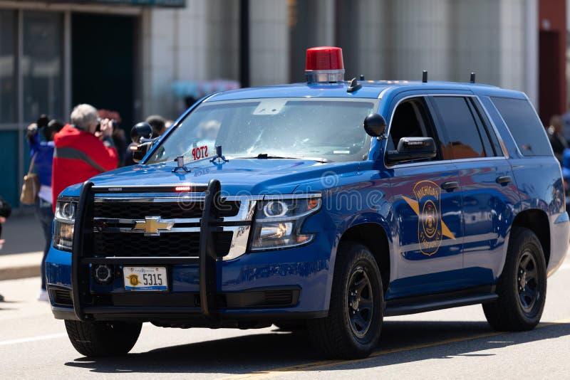 Benton Harbor, Michigan, USA - May 4, 2019: Blossomtime Festival Grand Floral Parade, Michigan state police vehicle leading the start of the parade. Benton Harbor, Michigan, USA - May 4, 2019: Blossomtime Festival Grand Floral Parade, Michigan state police vehicle leading the start of the parade